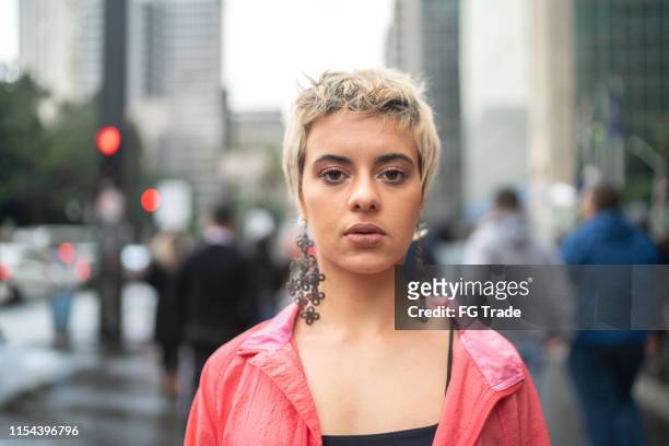 portrait of a young latin woman in the city - short hair stock pictures, royalty-free photos & images