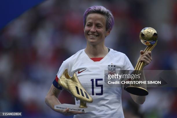 United States' forward Megan Rapinoe poses with the Golden Boot and Golden Ball awards after the France 2019 Womens World Cup football final match...