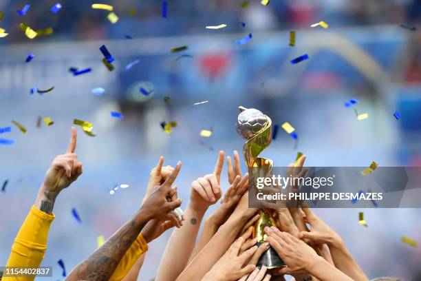 S players celebrate with the trophy after the France 2019 Women's World Cup football final match between USA and the Netherlands, on July 7 at the...