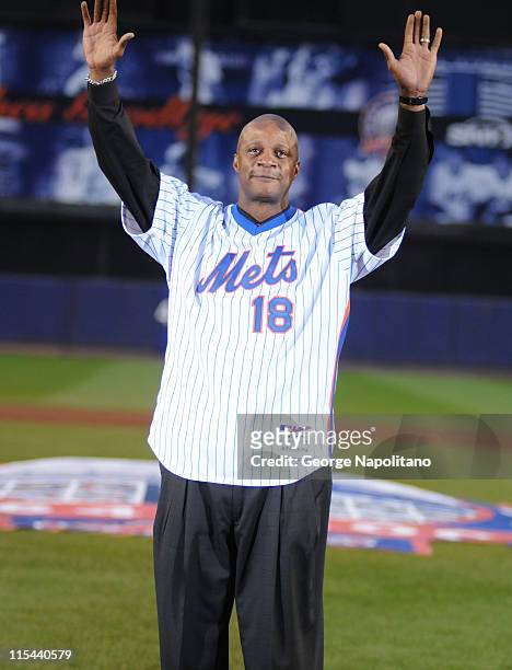 Former New York Mets all star Darryl Strawberry acknowledges the cheers of the crowd during the Mets last regular season baseball game played in Shea...