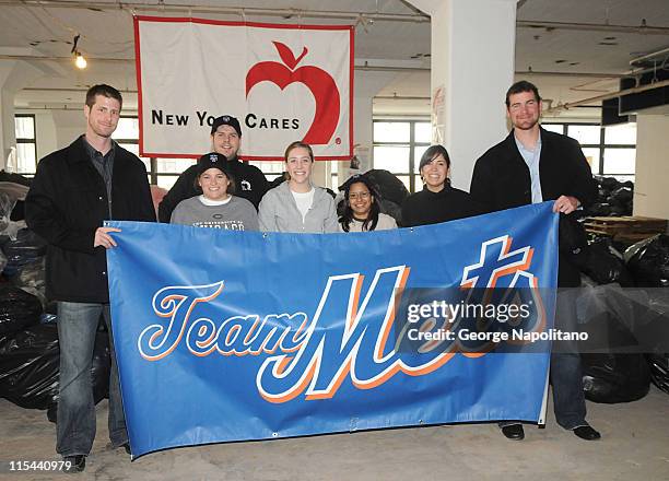 Mets pitcher John Maine, NY Cares Director Wes Moe, volunteers Hannah Bachman, Laura Dudney, Maura Martinez and Lucy Phillipe and Mets pitcher Mike...