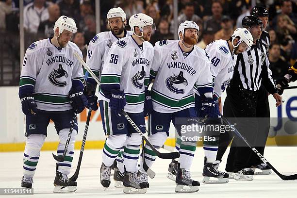 Sami Salo, Andrew Alberts, Jannik Hansen, Raffi Torres and Maxim Lapierre of the Vancouver Canucks look on towards the end Game Three against the...