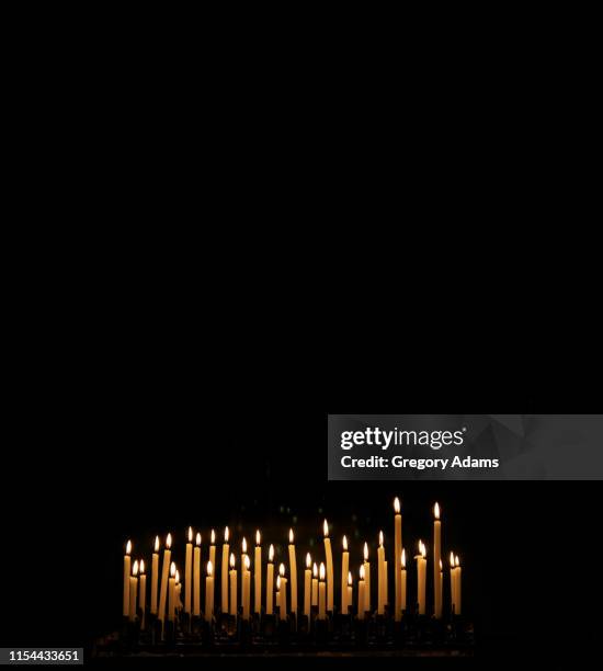 votive candles in a tuscan church - votive candle stock pictures, royalty-free photos & images