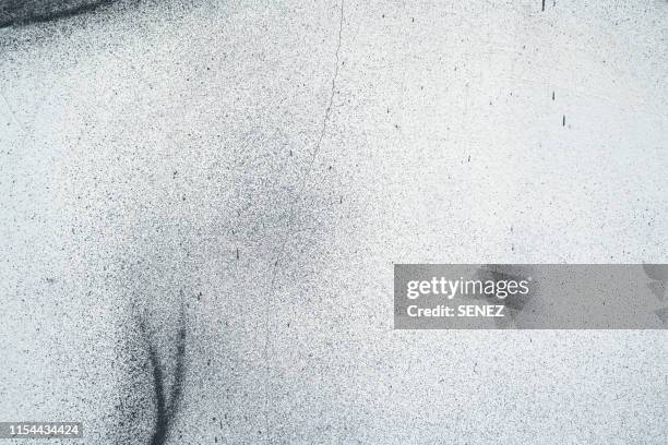 close-up of spray paint on white wall - weathered paint stock pictures, royalty-free photos & images