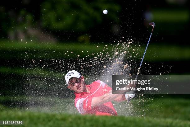 Julian Etulain of Argentina plays a shot from a bunker on the fourth hole during the second round of the RBC Canadian Open at Hamilton Golf and...