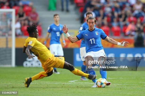 Ousmane Diakite of Mali tackles Luca Pellegrini of Italy which Ibrahima Kone later receives a red card for during the 2019 FIFA U-20 World Cup...