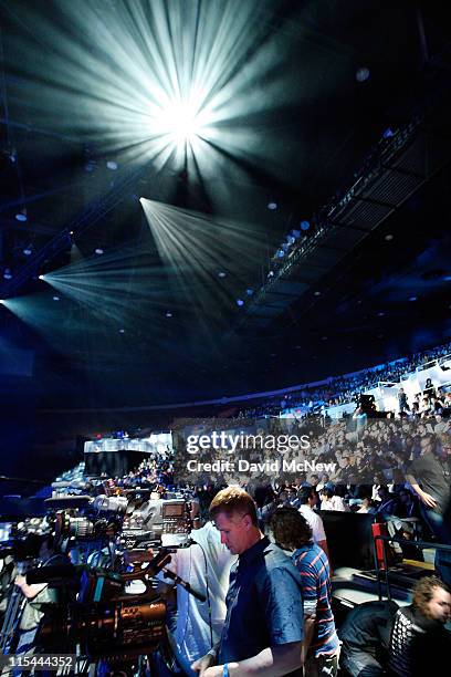 Attendees wear 3-D glasses to watch game demonstrations at the Sony Playstation media briefing on the eve of the Electronic Entertainment Expo on...