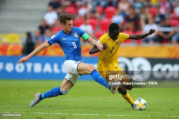 Andrea Pinamonti of Italy tackles Arnaud Konan of Mali during the 2019 FIFA U-20 World Cup Quarter Final match between Italy and Mali at Tychy...