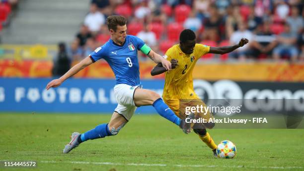 Andrea Pinamonti of Italy tackles Arnaud Konan of Mali during the 2019 FIFA U-20 World Cup Quarter Final match between Italy and Mali at Tychy...