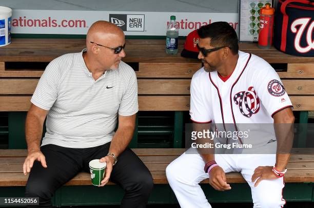 Manager Dave Martinez of the Washington Nationals talks with General Manager Mike Rizzo before the game against the Kansas City Royals at Nationals...