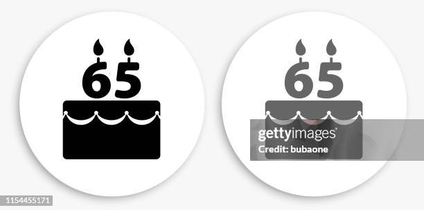 65 years birthday cake black and white round icon - birthday candles stock illustrations