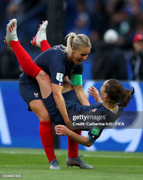 Amandine Henry and Gaetane Thiney of France celebrate following their team's first goal during the 2019 FIFA Women's World Cup France group A match...