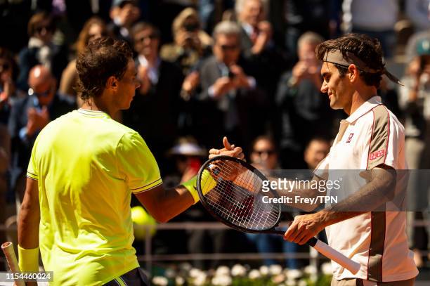 Rafael Nadal of Spain shakes hands with Roger Federer of Switzerland after beating him 6-3 6-4 6-2 in the semi finals of the men's singles during Day...