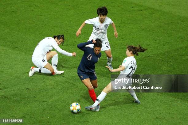 Valerie Gauvin of France battles for possession with Chaerim Kang, Hyeri Kim and Boram Hwang of Korea Republic during the 2019 FIFA Women's World Cup...