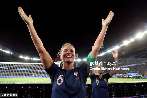 Amandine Henry and Eugenie Le Sommer of France celebrate with the fans following the 2019 FIFA Women's World Cup France group A match between France...