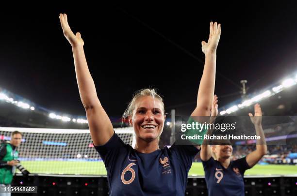 Amandine Henry and Eugenie Le Sommer of France celebrate with the fans following the 2019 FIFA Women's World Cup France group A match between France...