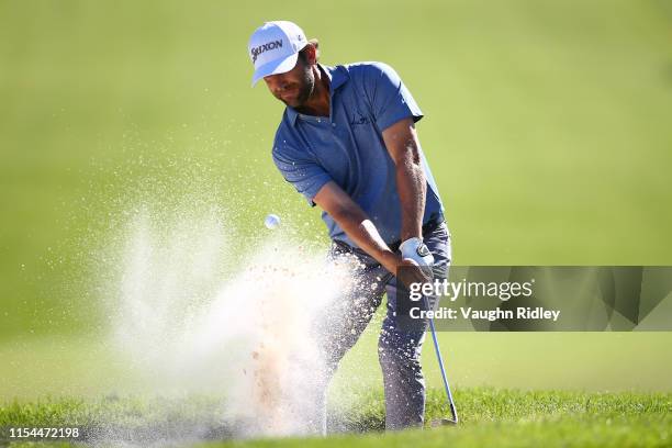 George McNeill of the United States plays a shot from a bunker on the ninth hole during the second round of the RBC Canadian Open at Hamilton Golf...