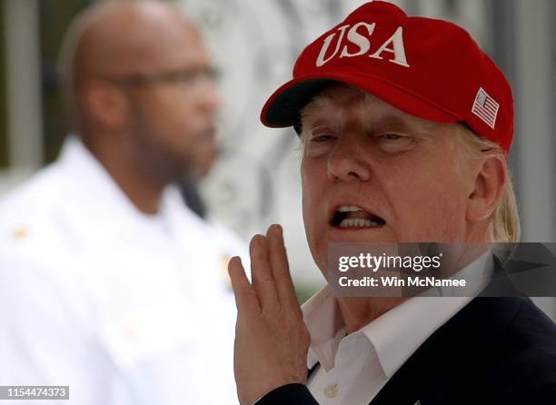 President Donald Trump shouts to reporters while returning to the White House June 7, 2019 in Washington, DC. Trump returned to the White House after...