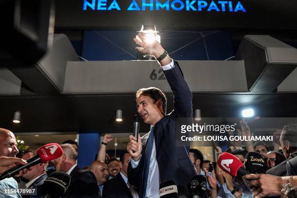 Greece's newly elected Prime Minister and leader of conservative New Democracy party Kyriakos Mitsotakis, speaks to the press outside the party's...