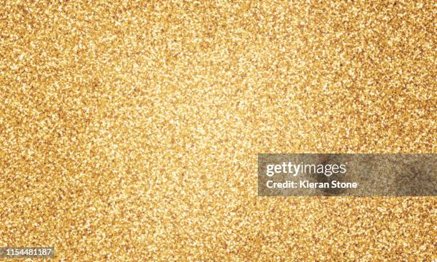gold glitter - gold glitter foto e immagini stock