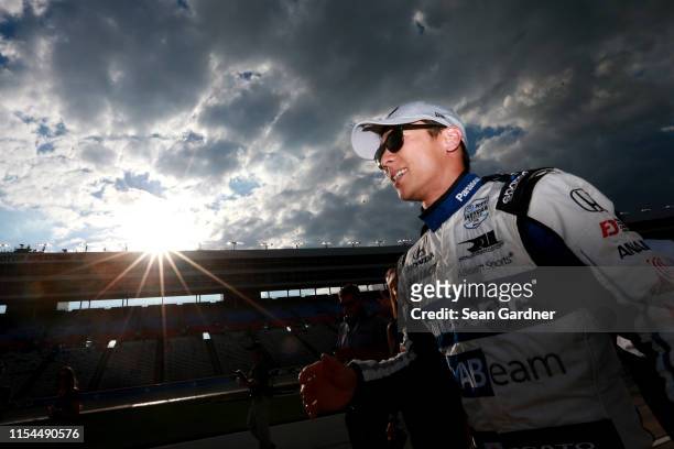 Takuma Sato of Japan, driver of the ABeam Consulting Honda, walks on pit road after winning the pole award during US Concrete Qualifying Day for the...