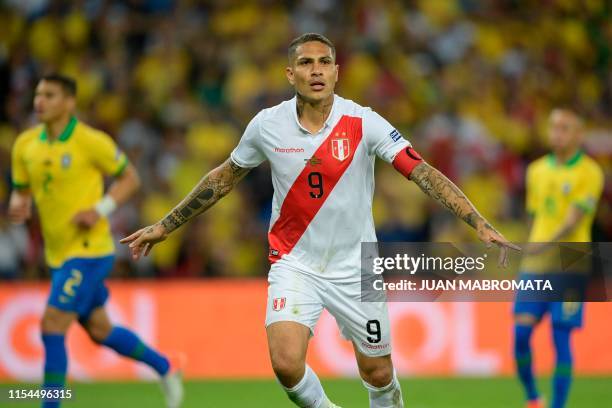 Peru's Paolo Guerrero celebrates after scoring a penalty against Brazil during the Copa America football tournament final match at Maracana Stadium...