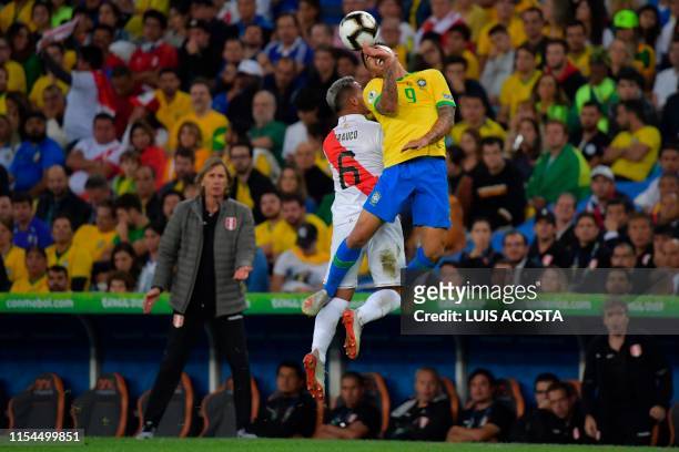 Brazil's Gabriel Jesus and Peru's Miguel Trauco vie for the ball during their Copa America football tournament final match at Maracana Stadium in Rio...