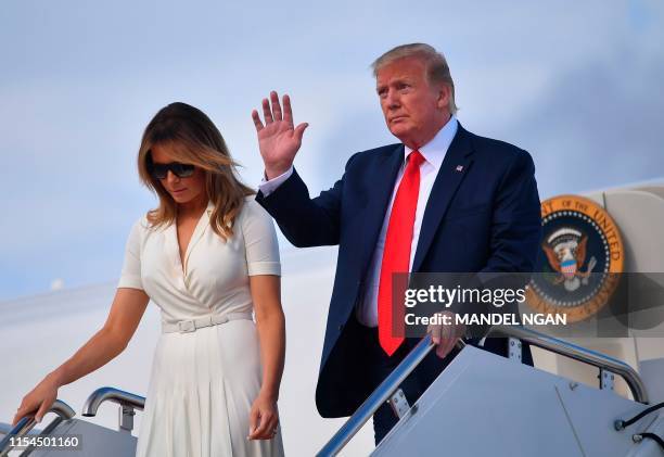 President Donald Trump and First Lady Melania Trump step off Air Force One upon arrival at Andrews Air Force Base in Maryland on July 7, 2019. -...