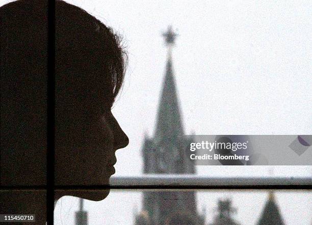 Anna Chapman, the former Russian spy, is seen reflected in a window during an interview at an office in Moscow, Russia, on Friday, June 3, 2011....