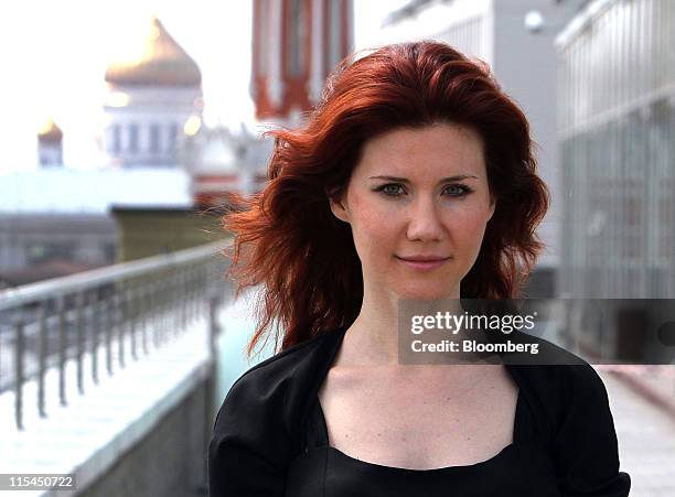 Anna Chapman, the former Russian spy, poses for a photograph against the Moscow skyline following an interview at an office in Moscow, Russia, on...