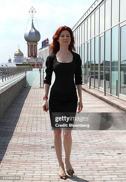 Anna Chapman, the former Russian spy, poses for a photograph against the Moscow skyline following an interview at an office in Moscow, Russia, on...
