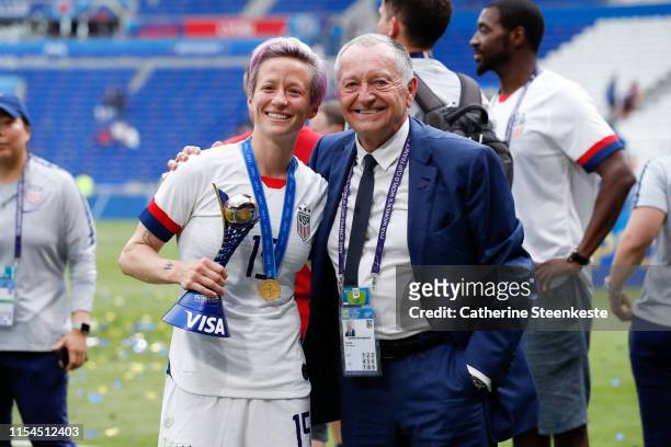 Megan Rapinoe of USA poses for a photo with Jean-Michel Aulas President of Olympique Lyonnais after the victory of the 2019 FIFA Women's World Cup...