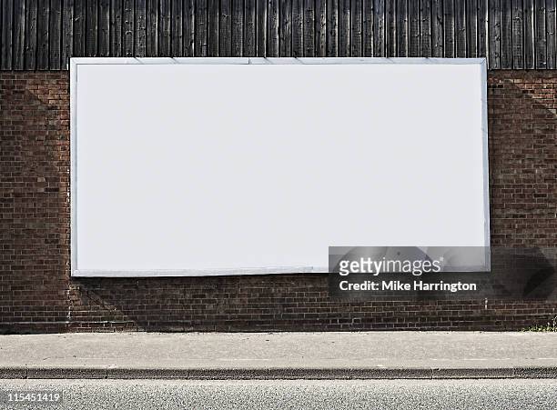 blank billboard on brick wall - billboard stock pictures, royalty-free photos & images