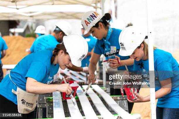 Volunteers participate in a Habitat for Humanity build on June 07, 2019 in Culver City, California.