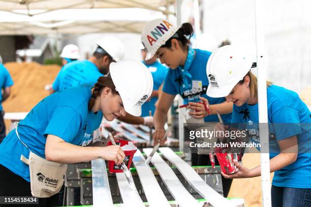 Volunteers participate in a Habitat for Humanity build on June 07, 2019 in Culver City, California.