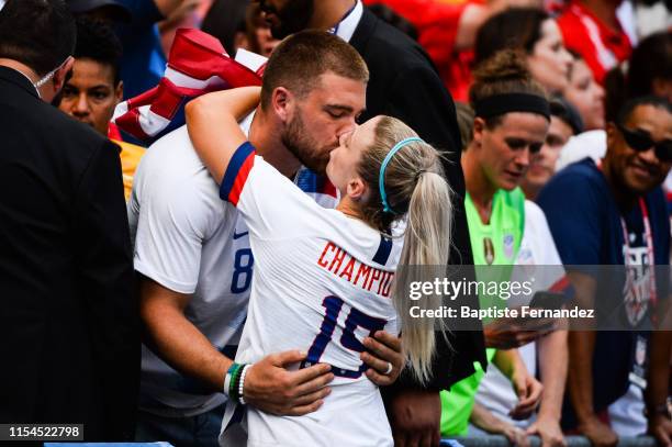 United State's midfielder Julie Ertz kisses her boyfriend to celebrate their victory after the 2019 FIFA Women's World Cup France Final match between...