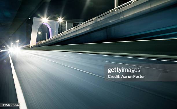 city street at night - motion blur road stock pictures, royalty-free photos & images