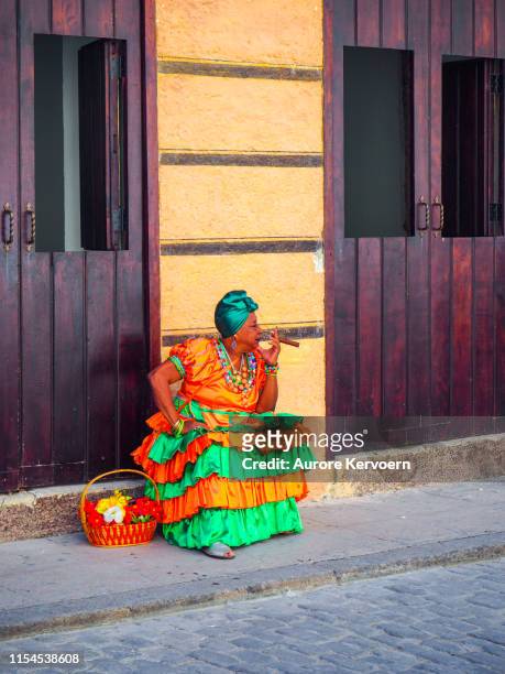woman in traditional dress in the streets of old havana in cuba - havana door stock pictures, royalty-free photos & images