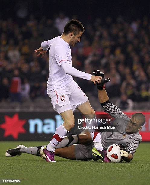 Adam Federici of Australia saves a goal attempt from Zoran Tosic of Serbia during the international friendly match between the Australian Socceroos...