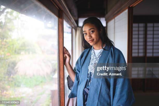 mixed race female guest at tokyo ryokan - yukata stock pictures, royalty-free photos & images