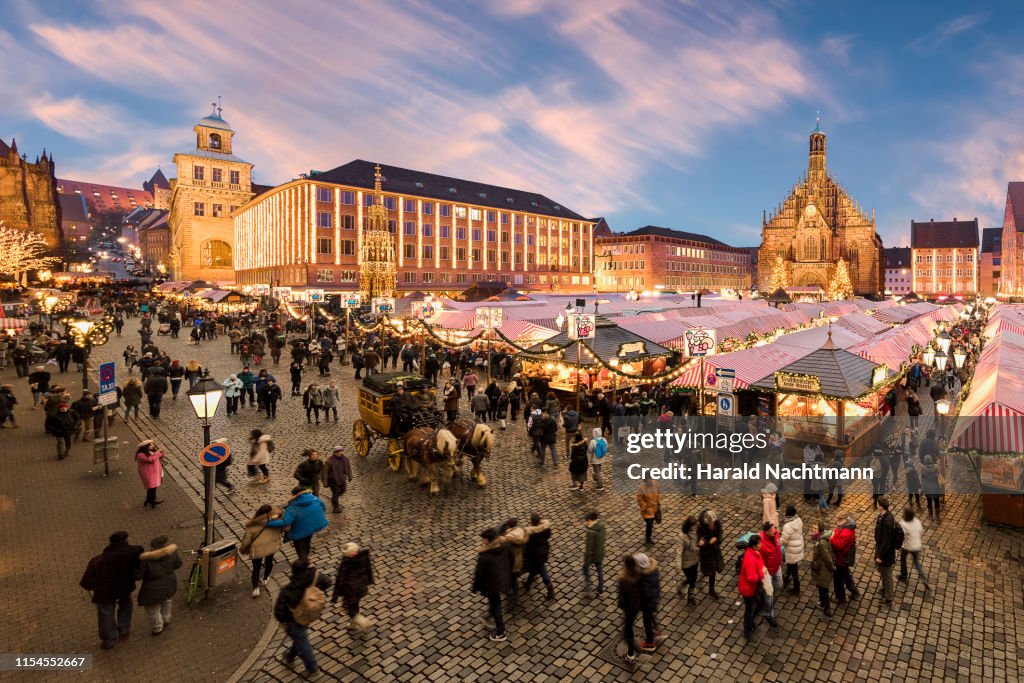 Christmas Market "Christkindlesmarkt" with Church of Our Lady in the background, Nuremberg, Bavaria, Germany