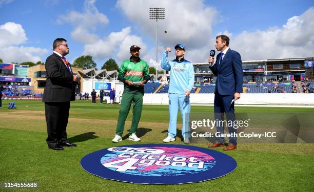 England captain Eoin Morgan tosses the coin alongside Bangladesh captain Mashrafe Mortaza ahead of the Group Stage match of the ICC Cricket World Cup...