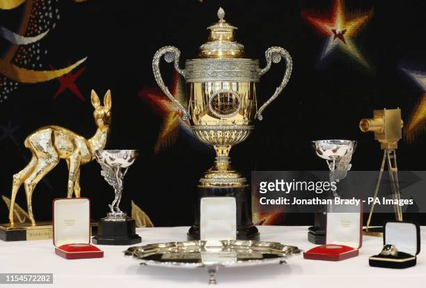 Selection of trophies, awards, and memorabilia from the tennis career of Boris Becker, including the Wimbledon singles trophy , on show in central...