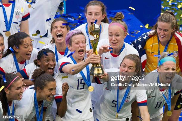 Megan Rapinoe of USA lifts the winners trophy and celebrates with team mates after the 2019 FIFA Women's World Cup France Final match between The...