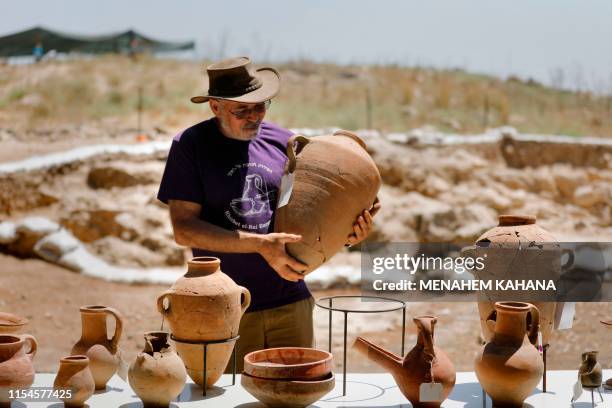 Yosef Garfinkel, professor at the Hebrew University, displays pottery vessels that were found at the site claimed to be the Biblical town of Ziklag...