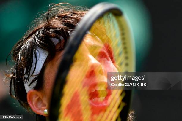 Spain's Carla Suarez Navarro returns against US player Serena Williams during their women's singles fourth round match on the seventh day of the 2019...