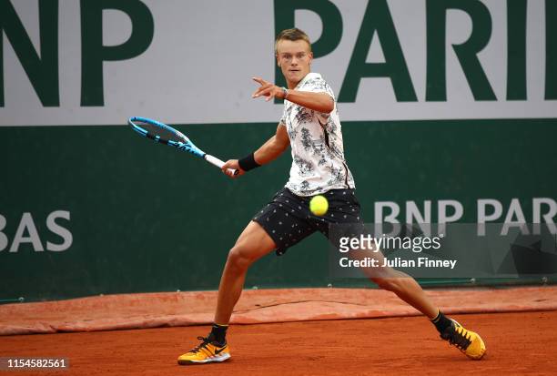 Holger Vitus Nodskov Rune of Denmark in his boys juniors singles final against Topby Kodat of The United States during Day fourteen of the 2019...