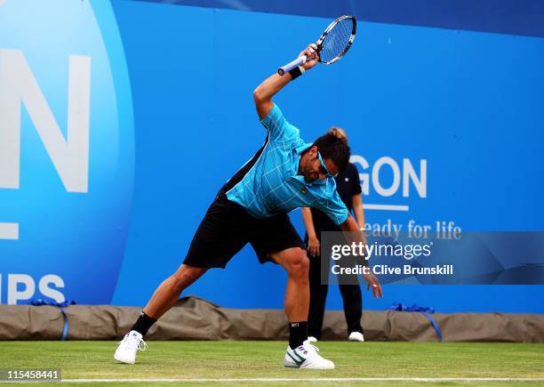 Janko Tipsarevic of Serbia shows his frustration and throws his racket during his Men's Singles first round match against Blaz Kavcic of Slovenia on...