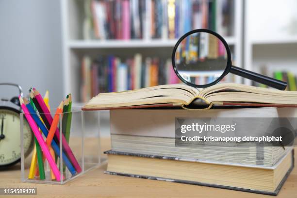 education concept,education,magnifying glass with books - rocket book stock pictures, royalty-free photos & images