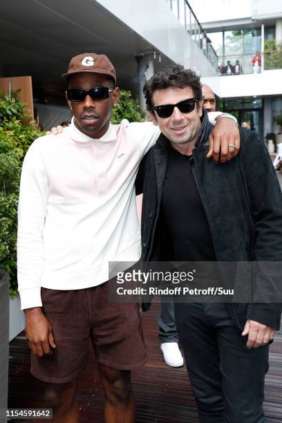 Tyler, The Creator", aka Tyler Okonma and Patrick Bruel attend the 2019 French Tennis Open - Day Fourteen at Roland Garros on June 08, 2019 in Paris,...